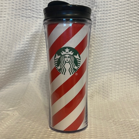 Starbucks Christmas candy cane stripe 16 fluid ounce travel coffee cup.